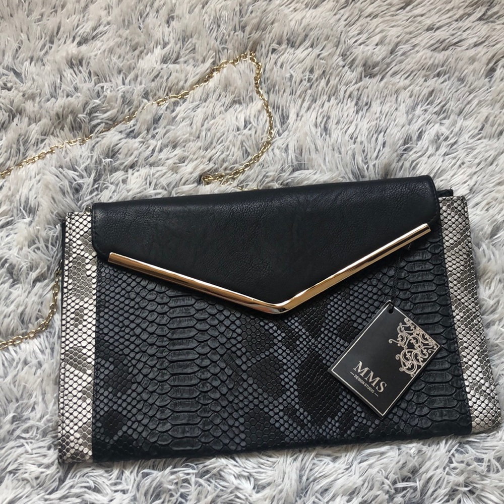 Black and gold clutch bag